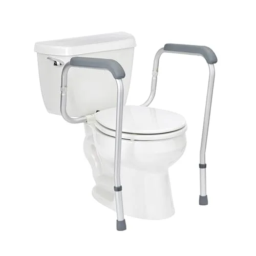 Medline freestanding toilet safety frame with padded armrests fitted around a standard toilet